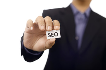 Man Holding Paper With SEO Text