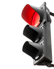 Black traffic lights with red stop signal isolated on white