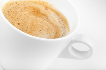 Fototapeta premium Cappuccino coffee in white ceramic cup, macro photo with selecti