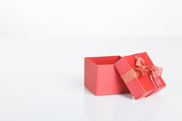 An empty red gift box with the lid off