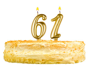 birthday cake with candles number sixty one isolated on white