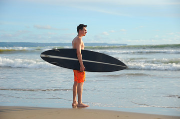 Fototapeta na wymiar Surfer with board
