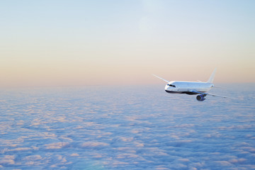 Fototapeta premium Airplane flying above clouds