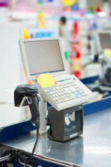 Empty cash desk with computer terminal in supermarket