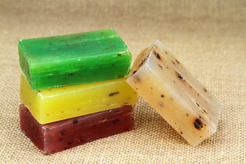 Colorful natural herbal soaps on burlap