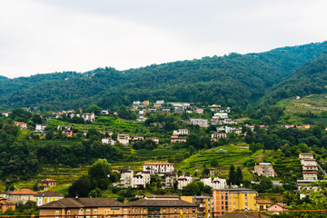 Fototapeta premium Alps mountains and town summer landscape.