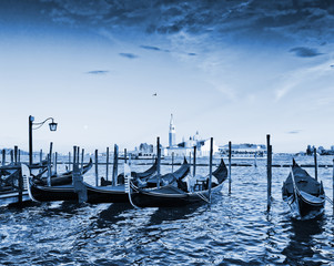 Naklejka premium Gondolas moored by Saint Mark square with San Giorgio di Maggior