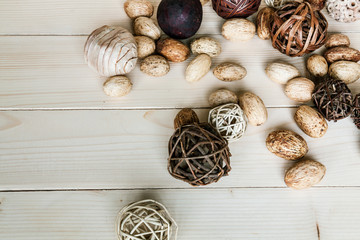 Brown rattan balls on old wooden background