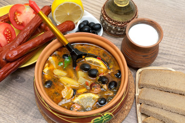 Obraz na płótnie Canvas Russian thistle soup and other food on wooden background
