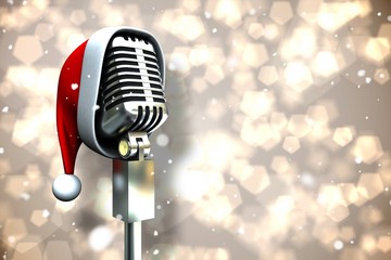 Composite image of microphone with santa hat - Powered by Adobe