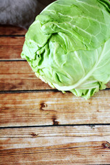 whole fresh cabbage on the boards