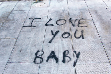 Graffiti on sidewalk I love you baby