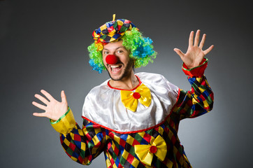 Funny clown in colourful costume