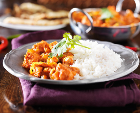 indian chicken vindaloo curry with basmati rice on plate
