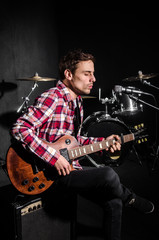 Man with guitar during concert