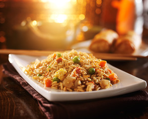 chinese fried rice on plate with orange glow
