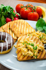 Healthy breakfast scrambled eggs with chive, panini toast