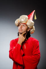 Funny wizard wearing red dress