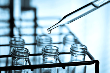 Obraz premium Laboratory research, dropping liquid to test tube