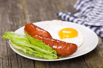 Breakfast plate with sausages and eggs