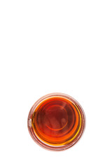 Honey in glass jar over white background