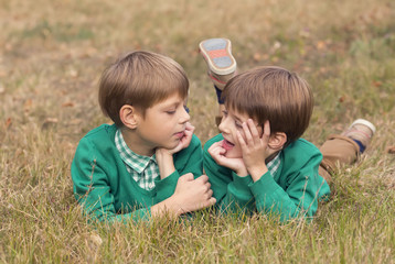 Fototapeta premium Portrait of a boy on a background of green nature