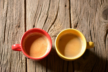 Coffee in a cup on a wooden table