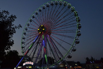 Ferris wheel with light in the evening