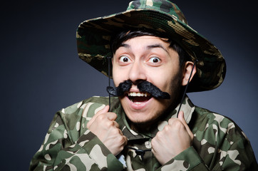Funny soldier in military concept
