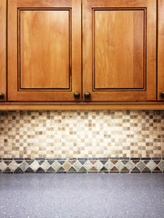 Kitchen with wooden cabinets and tile decor