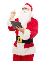 man in costume of santa claus with tablet pc