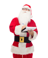 man in costume of santa claus with notepad