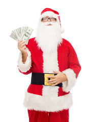 man in costume of santa claus with dollar money