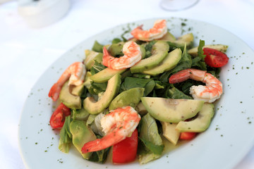Plate with shrimp and avocado salad