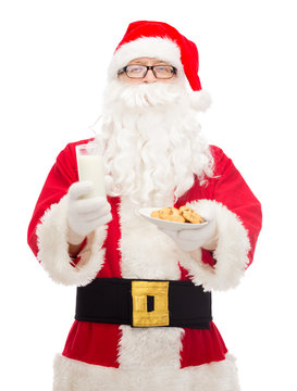 Santa Claus With Glass Of Milk And Cookies