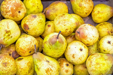 Yellow ripe pears at a market