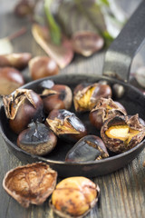 Frying pan with roasted chestnuts.