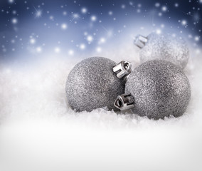 Christmas balls on abstract winter background