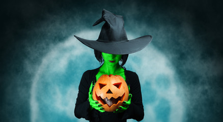 Mystery witch with pumpkin