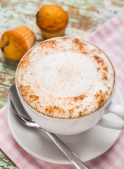 Cappuccino coffee with muffins
