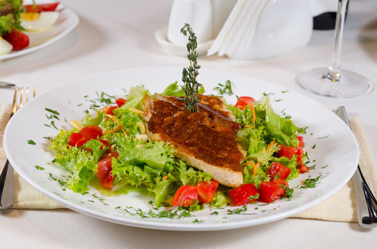 Delicious Recipe on Frisee Lettuce on White Plate