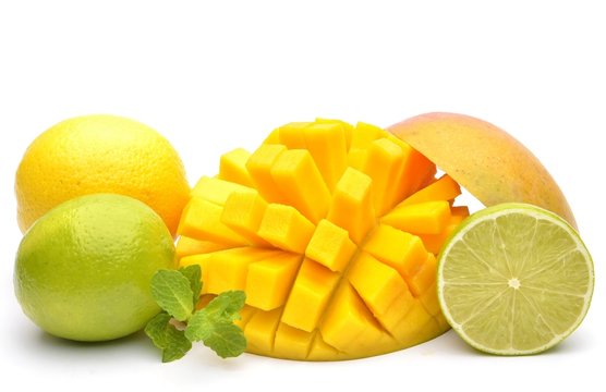 Slice of mango and other fruits on white background