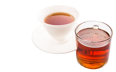 A cup of tea and a jar of honey over white background