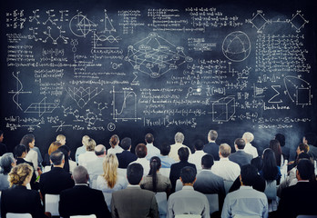 Multiethnic People with Formula on Chalkboard