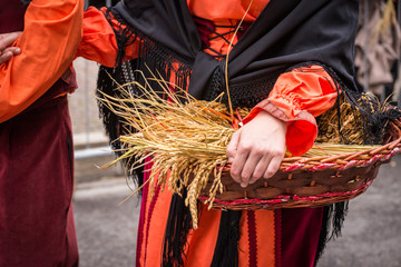 peasant with basket of grain