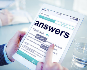 Man Reading the Definition of Answers