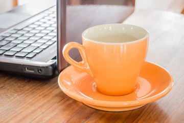Hot cup of tea on work table