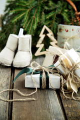 Christmas wrapped gifts and baby booties
