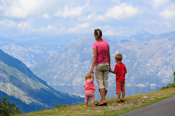 mother with kids travel in mountains