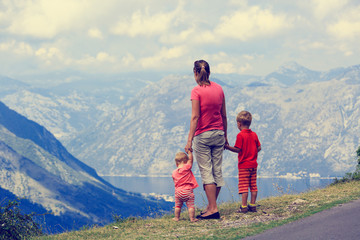 Fototapeta na wymiar mother with kids travel in mountains